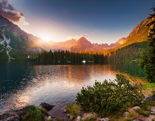 tatra national park a lake in the mountains at the dawn of the sun poland © James