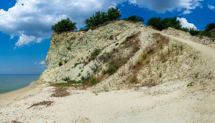 Mount Pyvykha rises along the shore of the Kremenchuk Reservoir in Ukraine, resembling a massive...