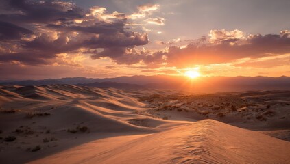 Stunning desert landscape at sunset with golden sand dunes, dramatic clouds, and distant mountains du warm twilight hour
