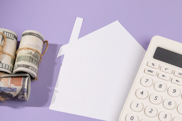 Budgeting for Homeownership – Paper House with Cash and Calculator