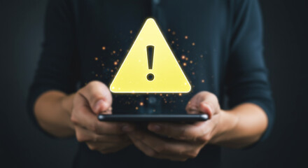 Mobile Alert: A person's hands cradle a modern smartphone, overlaid with a vivid digital hazard warning. The image conveys the immediate relevance of alerts in the digital age.