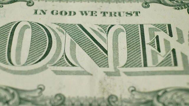 Reverse side of 1963 one dollar bill featuring ONE inscription. Highlights design elements of US currency. Concept of paper money used as legal tender for transactions and payments