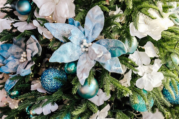 Beautiful blue and white decorations on a festive Christmas tree during the holiday season