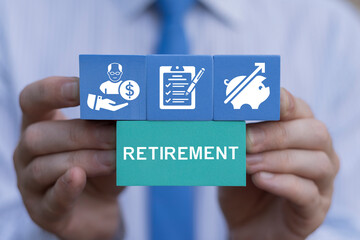 Retirement Pension Plan Savings Consulting Concept. Business person holding colored blocks sees text: RETIREMENT.