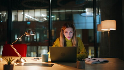 Entrepreneur developing project night office. Creative manager working laptop