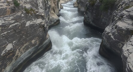 Turbulent River Flowing Through Rocky Gorge Aerial View