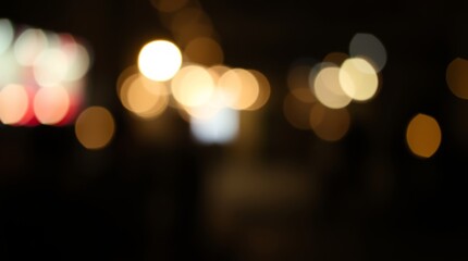 Fototapeta premium Dreamy Bokeh City Lights: A captivating display of blurred city lights, creating a serene ambiance, perfect for conveying atmosphere and abstract beauty.