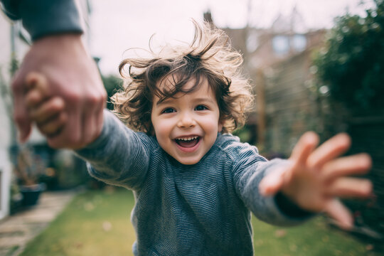 Happy child running to embrace parent joyful child young child