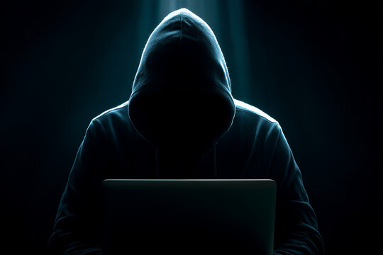 Hacker: cybersecurity hacker concept dark hooded hacker scene