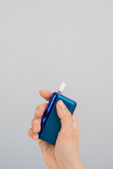 Woman holding electronic cigarette on white background. Tobacco heating systems.