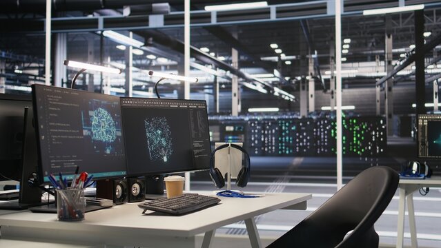 Server hub PC screens tracking rackmounts processing large scale machine learning datasets for artificial intelligence operations. Computer displays monitoring gear used in AI model development