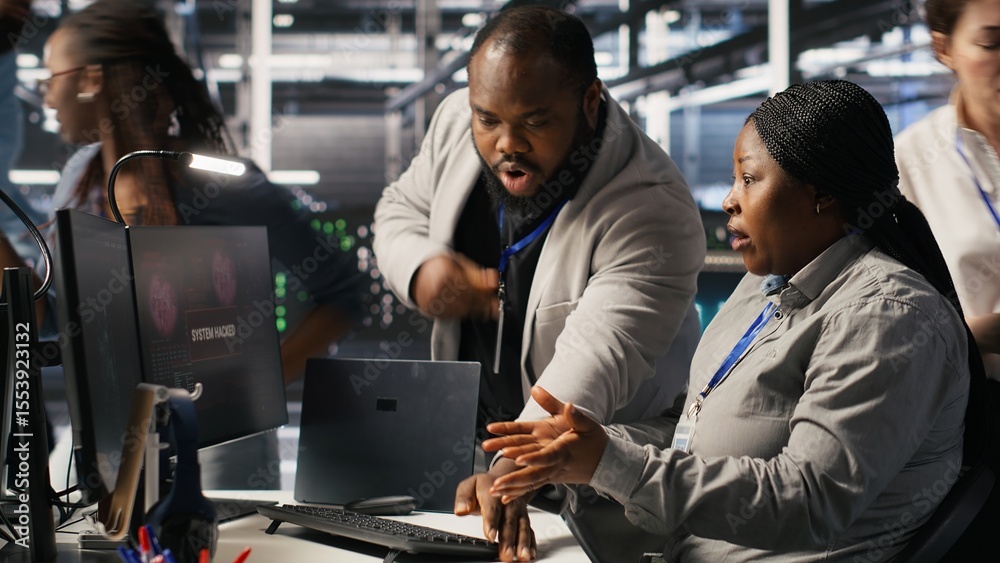 Poster scared data center technicians reacting to virus warning on pc display, scrambling to launch emergen