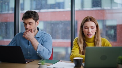 Corporate managers collaborating project discussing idea in office space closeup