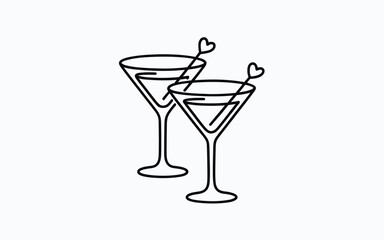 Two martini glasses with heart shaped garnishes on a white background