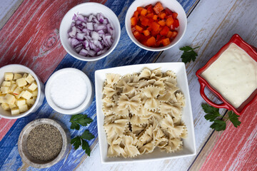 Celebrate Independence Day with a colorful macaroni salad featuring pepperjack cheese and fresh vegetables