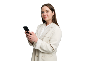 Engaged young woman in a stylish blazer interacting with her smartphone in a bright and minimalistic environment