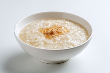 Classic rice gruel served in a bowl on a white backdrop with empty space