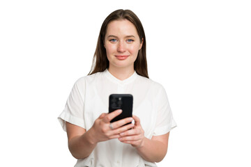 Fototapeta premium Young woman engages with smartphone in a bright, minimalistic indoor space while conveying a sense of connection and focus