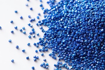 Cold cut blue polymer pigment granules on a white background for a plastic manufacturing catalog