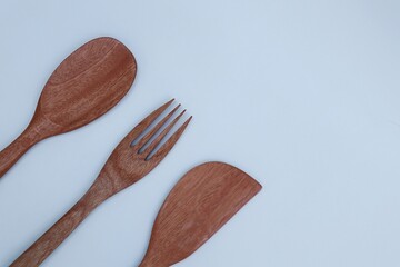 wooden cooking utensils on a white background