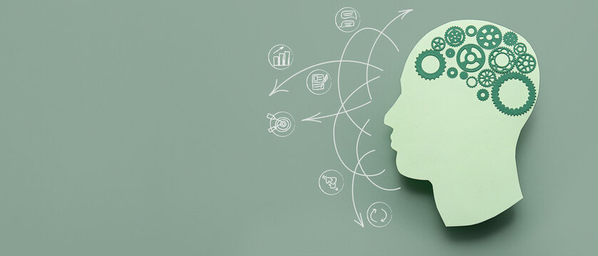 Paper human head with gears on green background with space for text. Concept of brainwork
