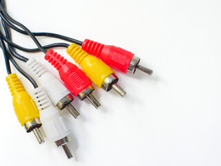 RCA cable with red, yellow, and white connectors, used for audio and video connections, isolated on...