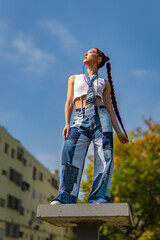 Woman with red braids and innovative patchwork style