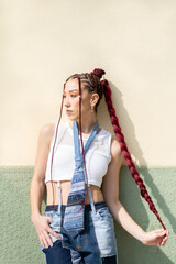 Woman with red braids and distinctive denim look