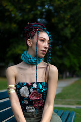 Woman with braids and distinctive fashion posing