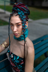 Portrait of a woman with colorful hair and distinctive attire