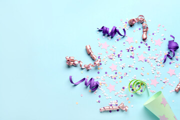 Party cone with serpentine and confetti on blue background