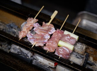 raw chicken on a skewer