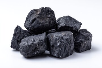 Fototapeta premium Collection of black coal pieces on a white background including anthracite raw nuggets and graphite samples