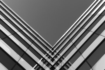 Black and white photo of a modern glass building corner, viewed from below. Emphasizes symmetry,...