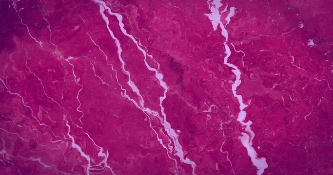 Revealing central river network snaking over textured terrain from aerial view, showing tributaries