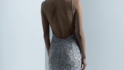 Glamorous lowback gown detail - Powered by Adobe