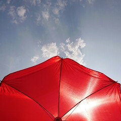 red umbrella on the sky background