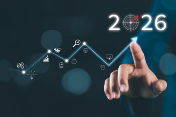 The 2026 new year business goals concept. Hand touching increase arrow graph company future growth 2026. Business plan target strategy, Planning and challenge business strategy in new year,