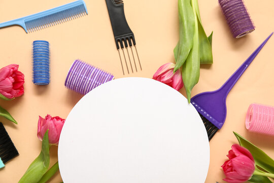 Blank card with hairdresser's tools and beautiful tulips on beige background - Powered by Adobe