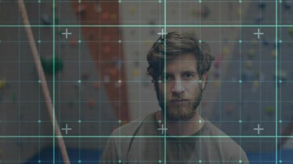 Climber standing at climbing wall in sports tech grid overlay shifting across torso simulating scan - Powered by Adobe