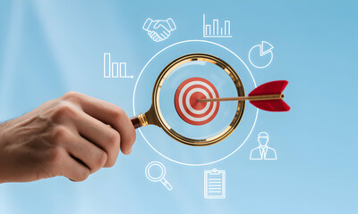 Target focus with magnifying glass and business icons