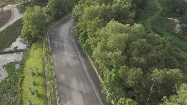 Aerial view of road with greeneries. Urban living masterplan. Green living concept. - Powered by Adobe