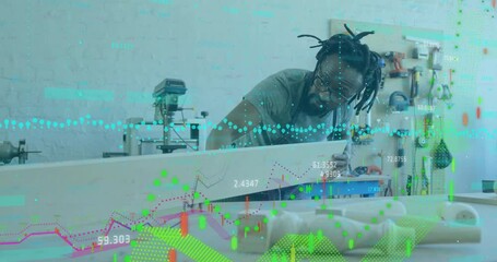 Woodshop craftsman picking up plank pushing into drill press as overlay tracking quality metrics - Powered by Adobe