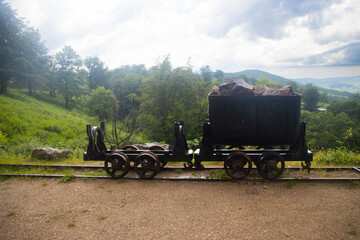 Wagon with bauxite rocks in front of the Crystal Farcu mine. Apuseni Mountains, unique in Romania