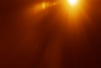 blurred image. shiny sun, sunbeams, sunrays, sunshine design. Yellow red orange warm light effect, sun ray, golden beams isolated on black background. star dust sparkling sunlight bursting through