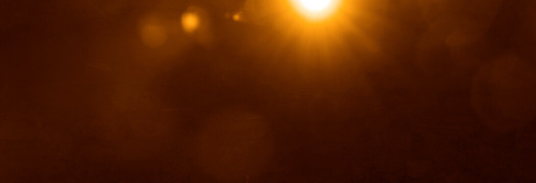 blurred image. shiny sun, sunbeams, sunrays, sunshine design. Yellow red orange warm light effect, sun ray, golden beams isolated on black background. star dust sparkling sunlight bursting through