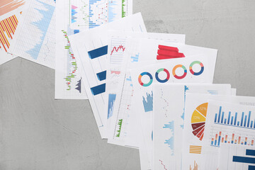 Many business graphics and diagrams on grunge grey background