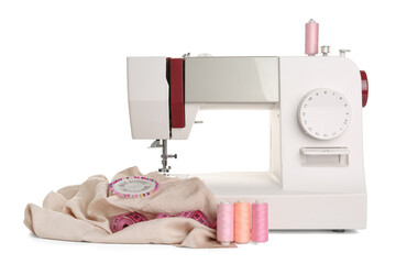 Sewing machine with cloth and thread spools on white background