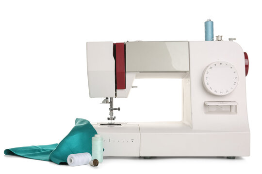 Sewing machine with cloth and thread spools on white background - Powered by Adobe