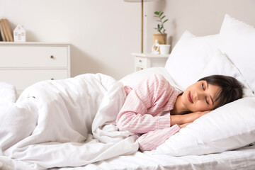 Morning of beautiful young woman sleeping on pillow in bedroom